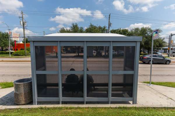 The perforated bus shelters have tiny holes throughout to allow airflow in the shelter for a cooling effect.